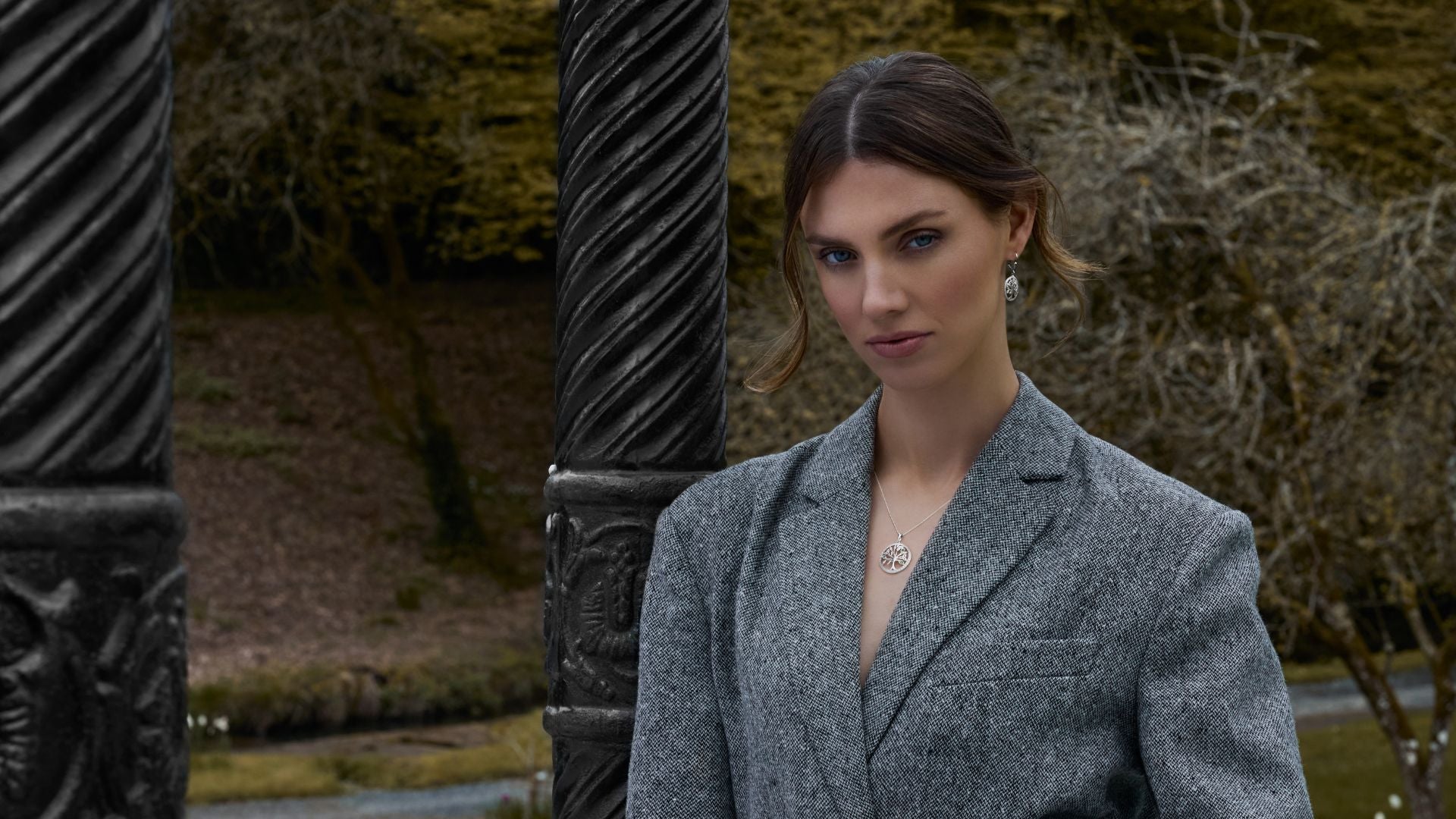 a model presenting celtic tree of life necklace and earrings