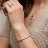 a model wearing celtic claddagh bangle from Solvar