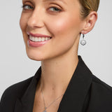 a female model wearing a matching Celtic Claddagh necklace and earrings set from Solvar