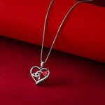 styled image of trinity heart necklace on red background