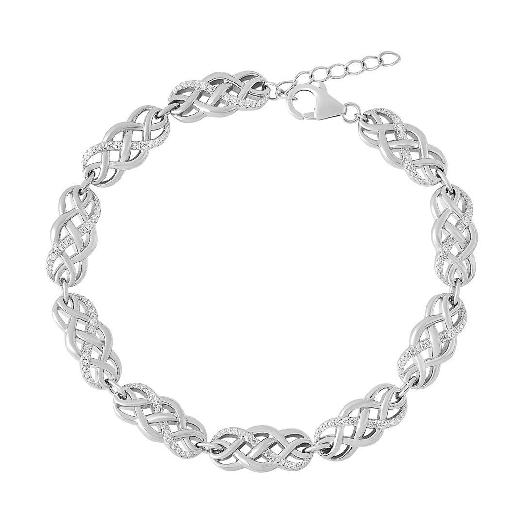 Silver bracelet with intricate Celtic knot design on a white background