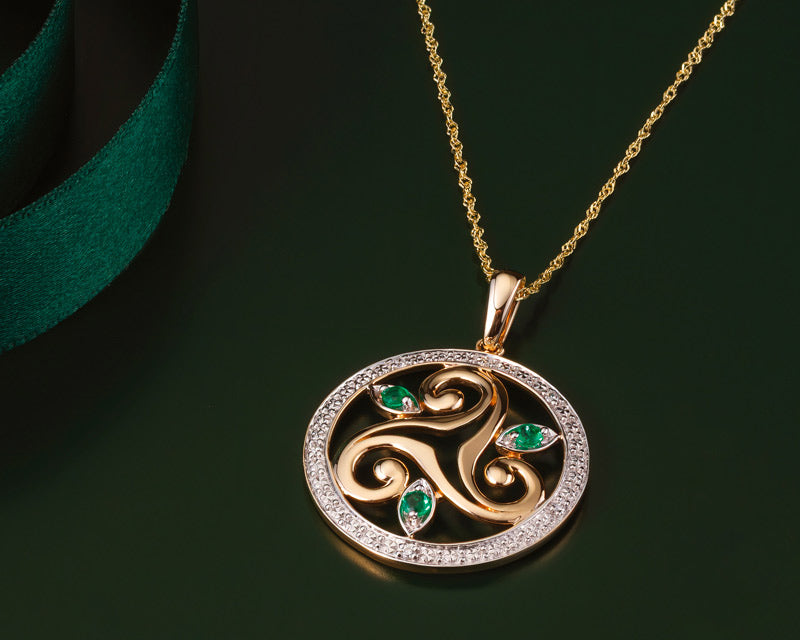 lifestyle image of gold emerald celtic spiral necklace