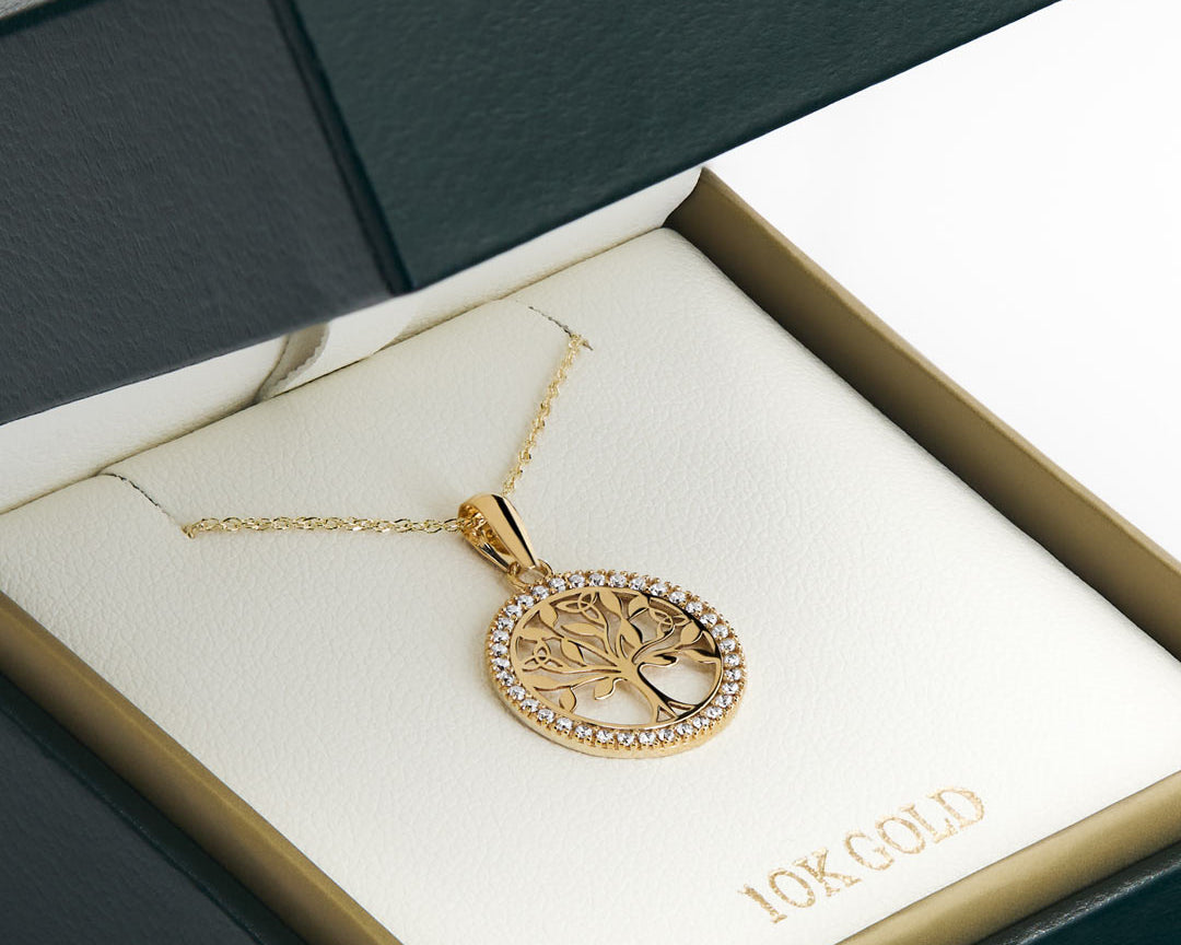yellow gold celtic cz tree of lie necklace presented in the solvar jewellery box