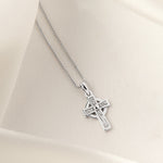 lifestyle image of kid's Celtic Cross necklace in silver
