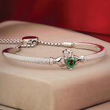 lifestyle image of silver Claddagh draw string bangle s5890