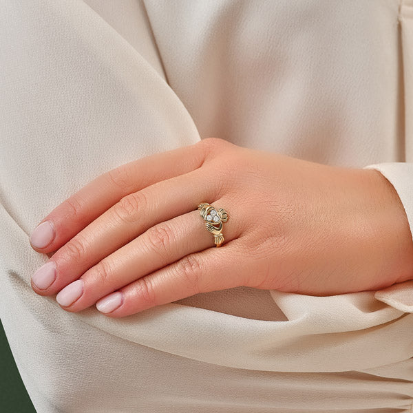 a model wearing the Claddagh ring on the ring finger of her left hand with the heart facing outwards implies engagement to get married