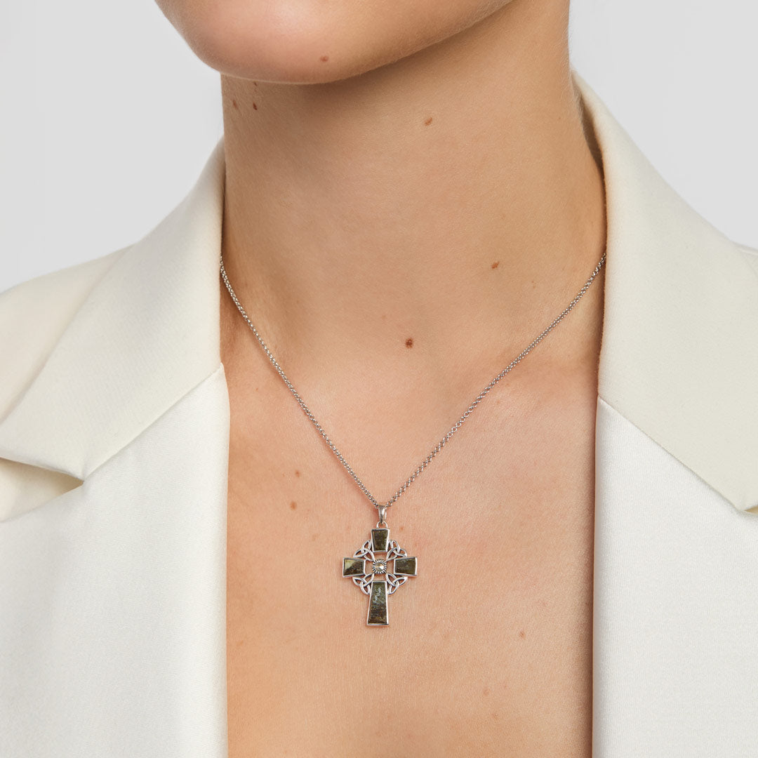 green marble Celtic cross pendant on a model