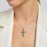 model wearing large celtic cross necklace with connemara marble round centre
