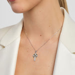 model wearing green marble celtic cross pendant in silver