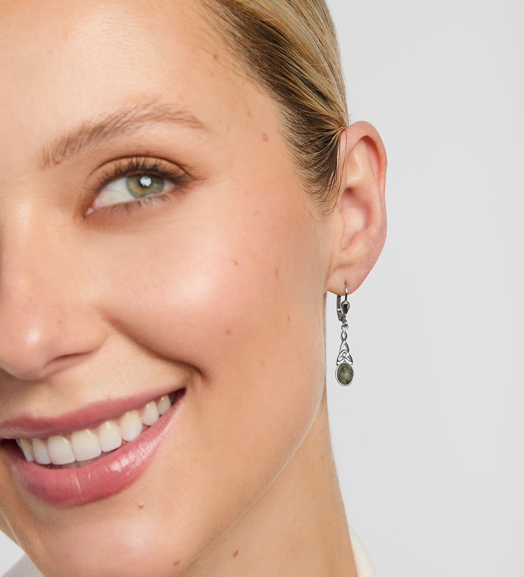 Celtic Knot drop earrings on a model