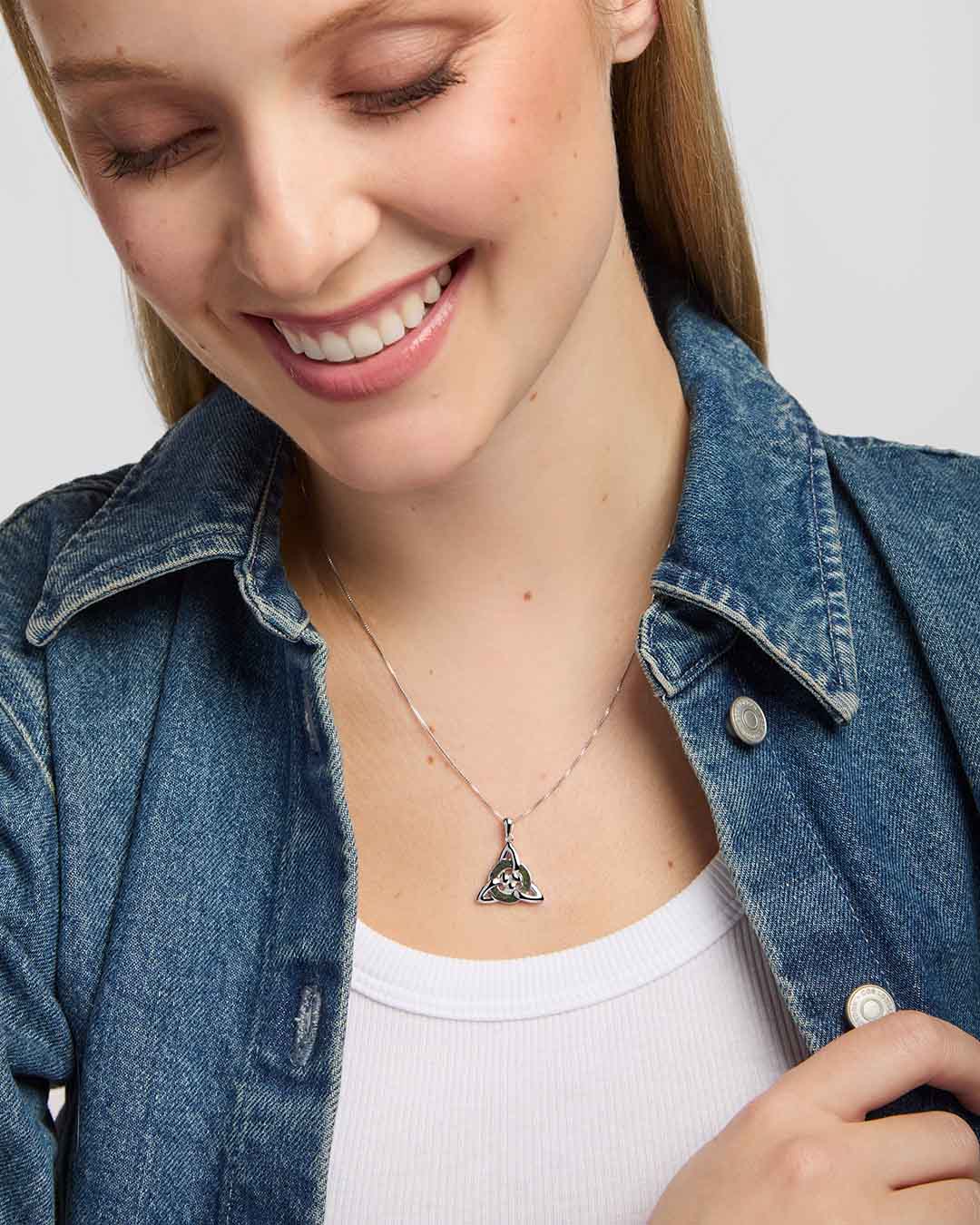 close-up image of Solvar connemara marble celt know pendant necklace presented on a model 