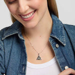 close-up image of Solvar connemara marble celt know pendant necklace presented on a model 