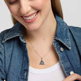 close-up image of Solvar connemara marble celt know pendant necklace presented on a model 