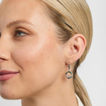 Green marble claddagh drop earrings on a model from Solvar