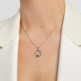 green marble and marcasite claddagh necklace on a model