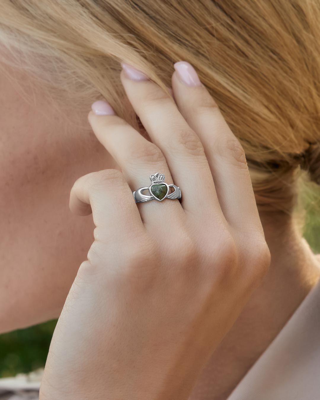 Solvar Connemara marble Claddagh ring on a model