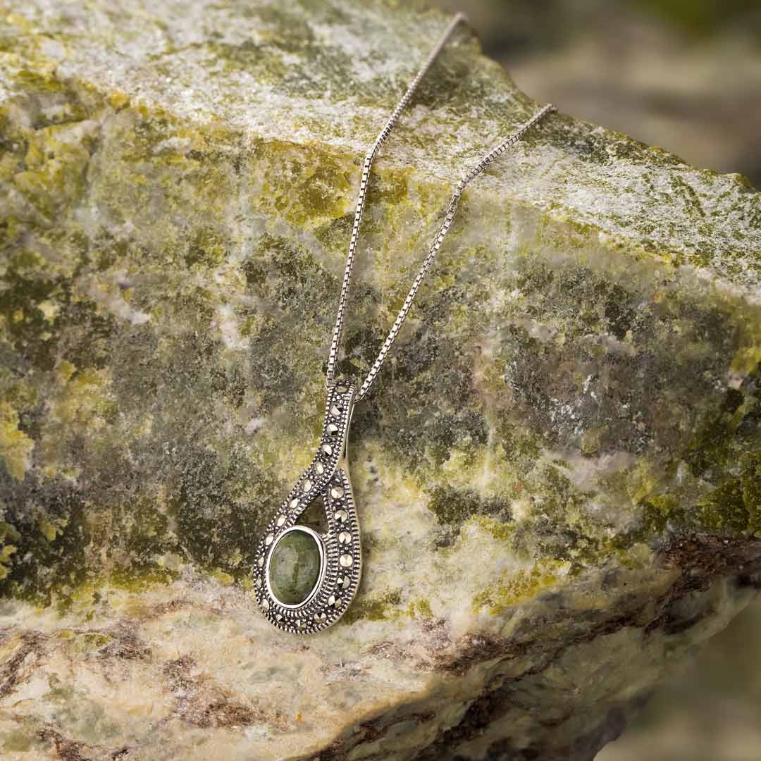 lifestyle image of marble & marcasite celtic necklace on connemara marble background