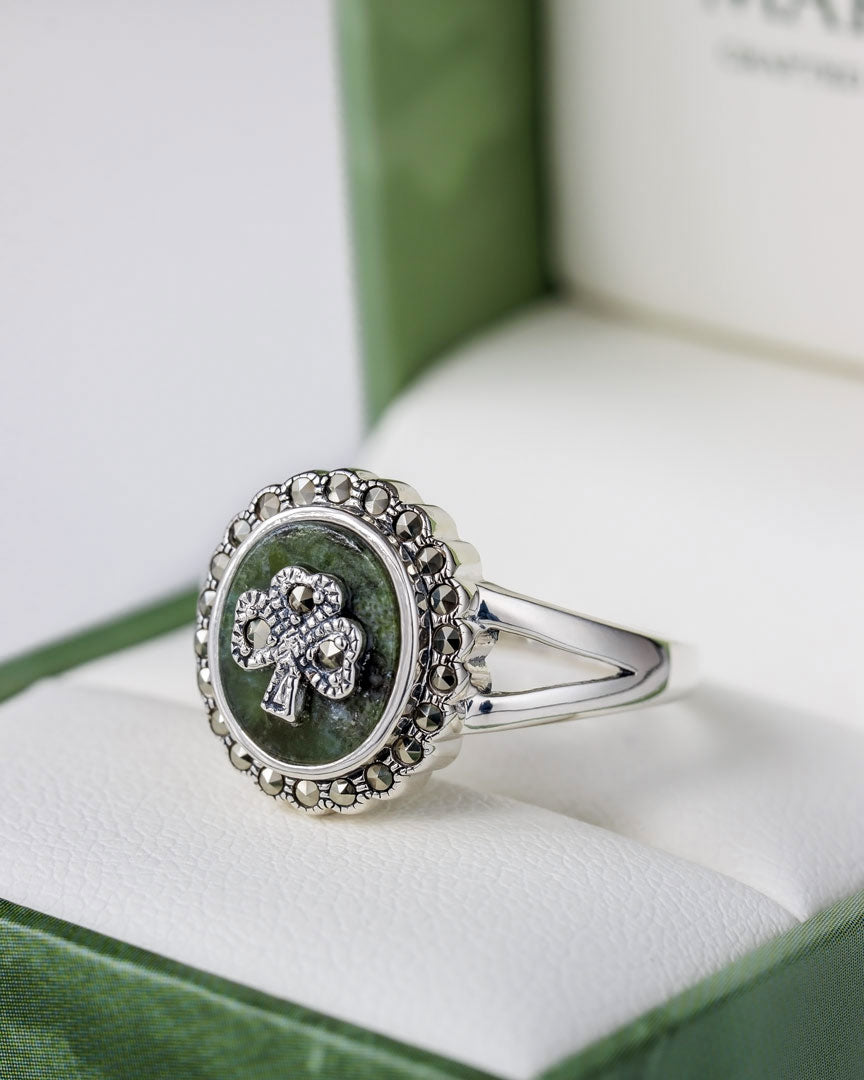 lifestyle closeup image of silver marcasite and connemara marble shamrock ring