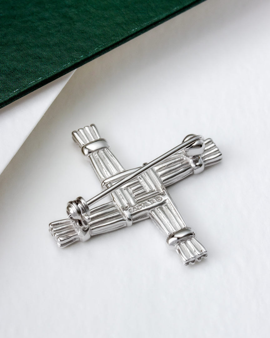 lifestyle image of the back of Connemara marble St Brigid's Cross brooch from Solvar