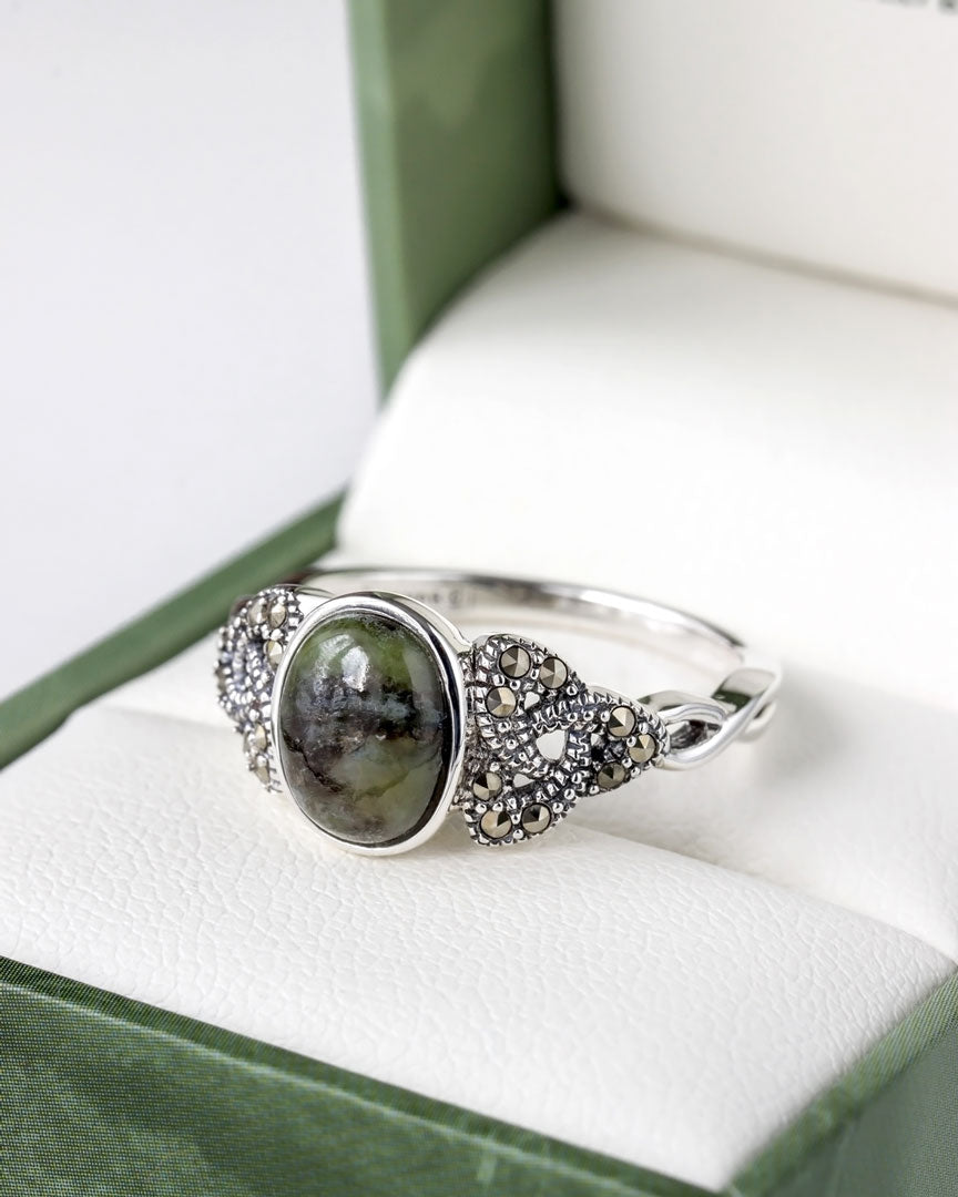 lifestyle closup image of marcasite and connemara marble trinity knot ring 1