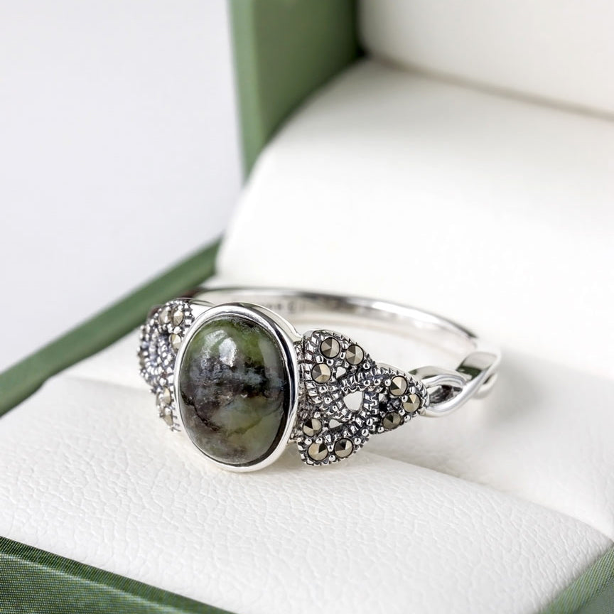 lifestyle closup image of marcasite and connemara marble trinity knot ring 1