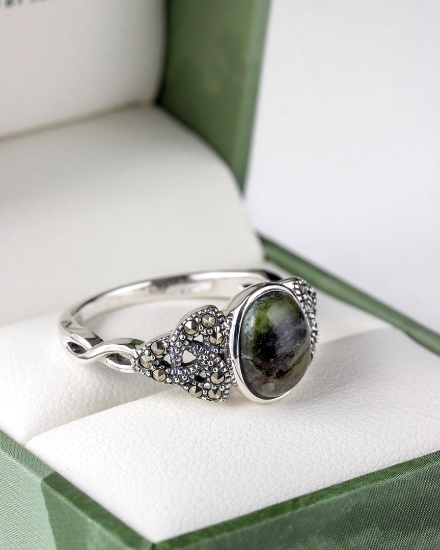 lifestyle closup image of marcasite and connemara marble trinity knot ring 2