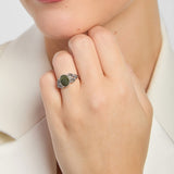 oval green marble celtic trinity knot ring on a model