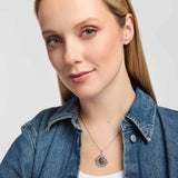 female model wearing Connemara marble and marcasite Celtic shamrock pendant with intricate knotwork on a silver chain
