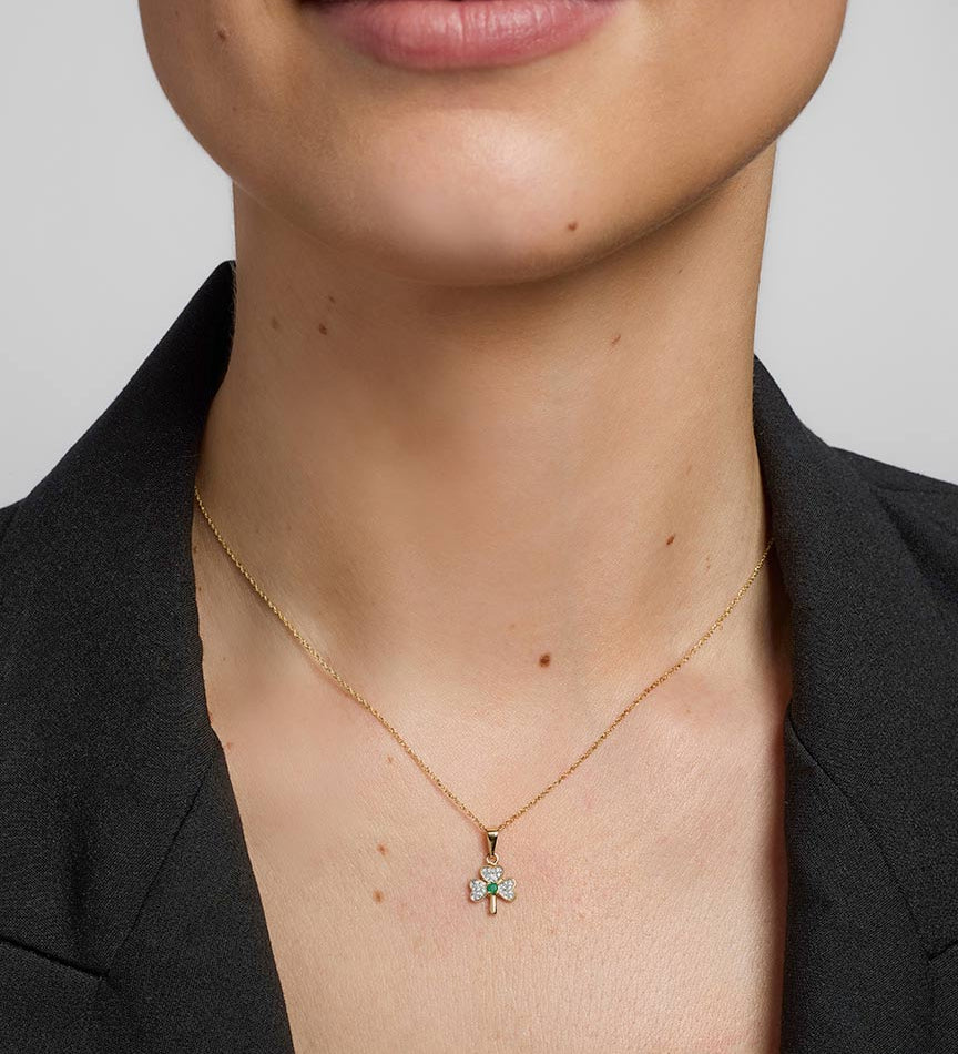 a model wearing gold diamond & emerald shamrock pendant s4512