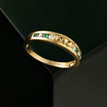 styled image of gold diamond and emerald claddagh eternity ring s2374 