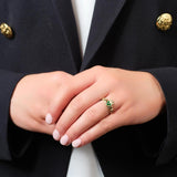 a model wearing gold emerald claddagh ring s2466