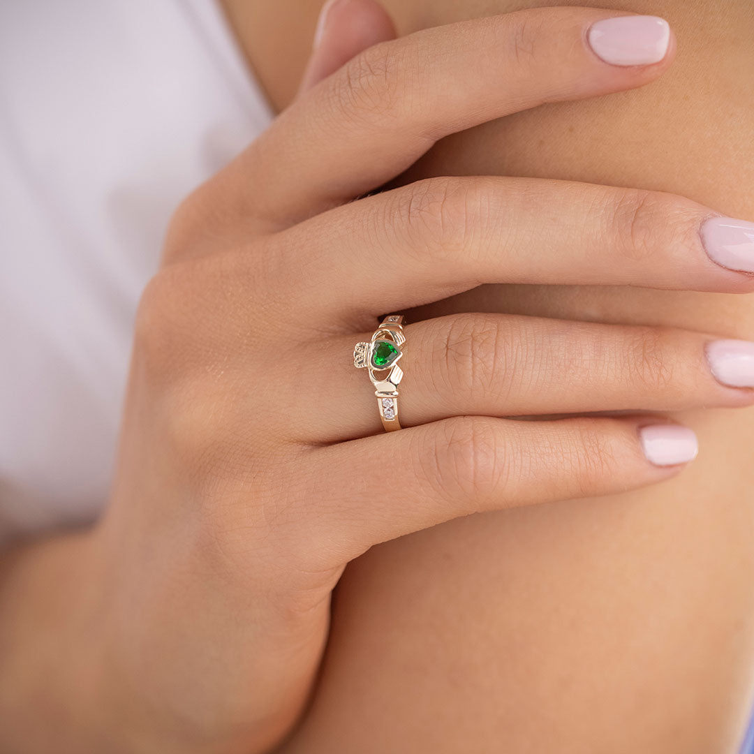 yellow gold Emerald & Cz Claddagh Ring on a model 1