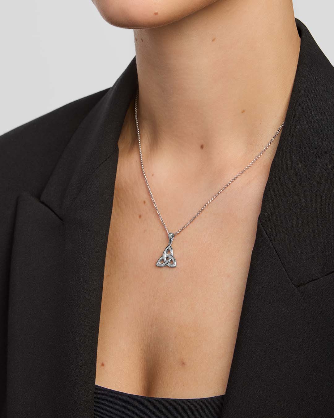 close-up image of large flush set cubic zirconia Trinity Knot pendant from Solvar