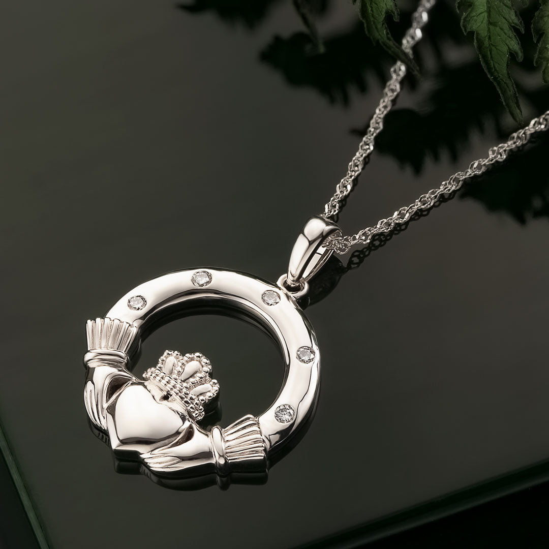 lifestyle image of white gold flush set claddagh necklace