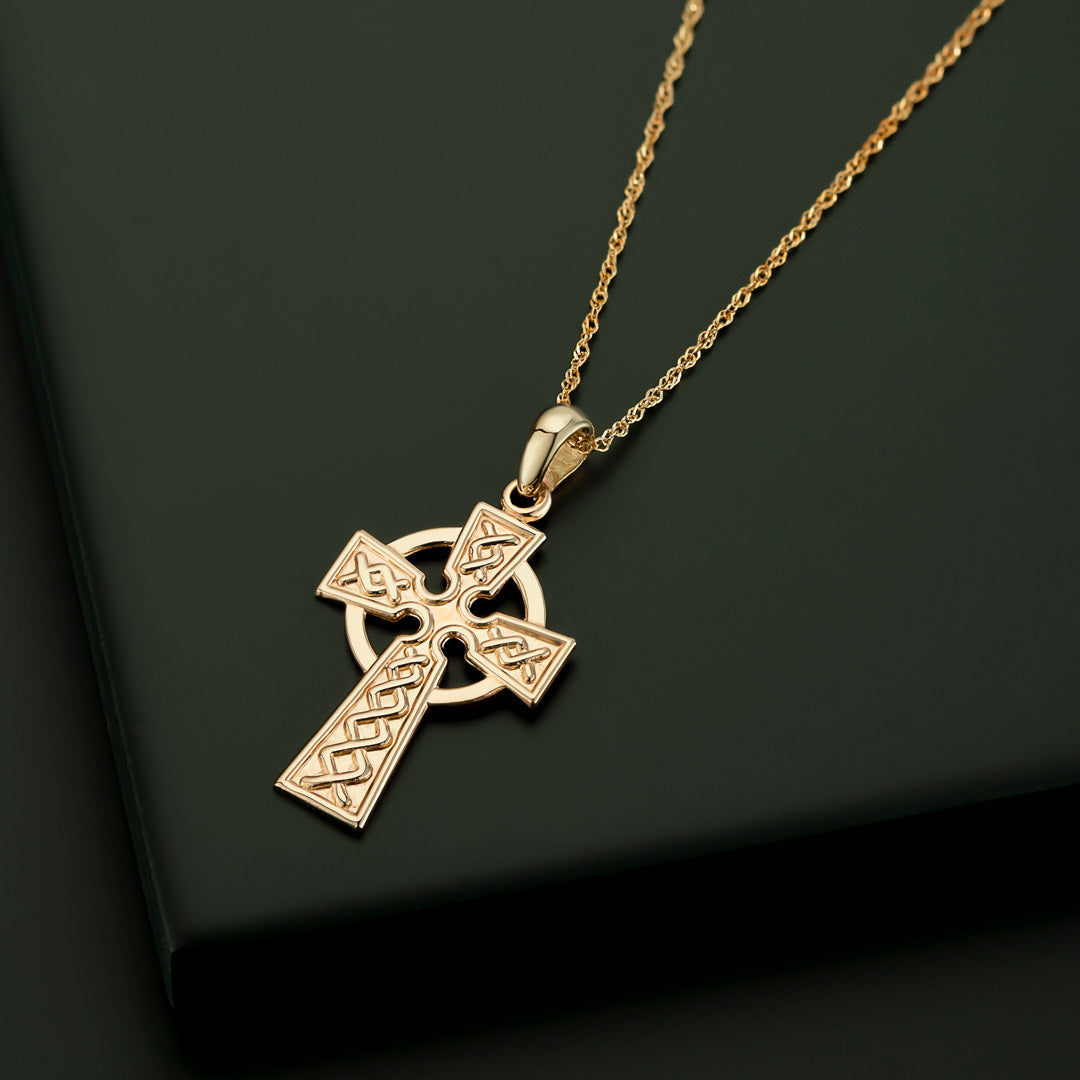 STYLED IMAGE OF GOLD CELTIC CROSS NECKLACE FROM SOLVAR