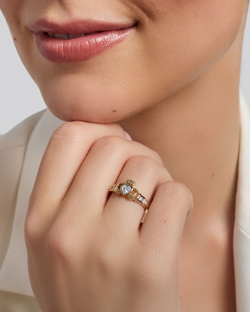 gold cz claddagh ring on a model