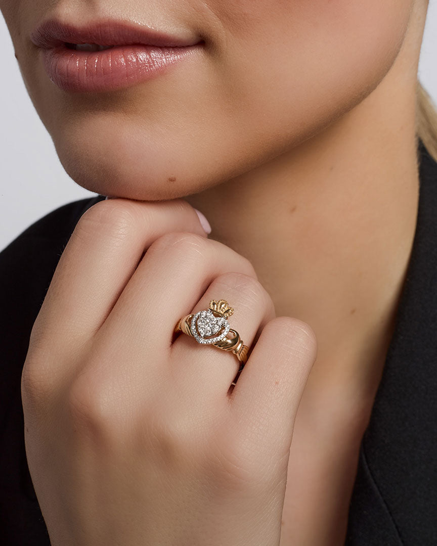 a model wearing gold diamond heart claddagh ring s21096 2