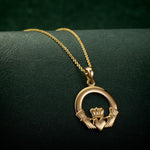 lifestyle image of gold heavy Claddagh pendant from Solvar