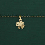 lifestyle image of yellow gold small shamrock necklace from Solvar