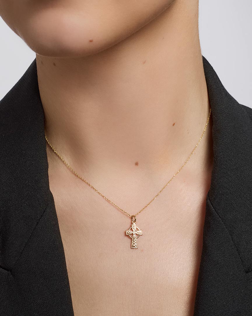 solvar gold small celtic cross pendant on a model