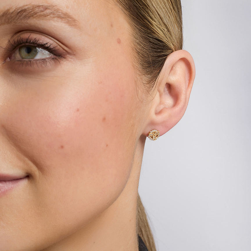 a model wearing Solvar cz set trinity knot stud earrings s34202