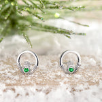 lifestyle image of green crystal Claddagh earrings from Solvar