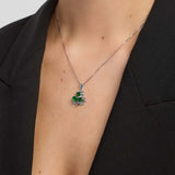 close-up image of green crystal Shamrock necklace on a model