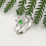 lifestyle image of green stone Claddagh rings