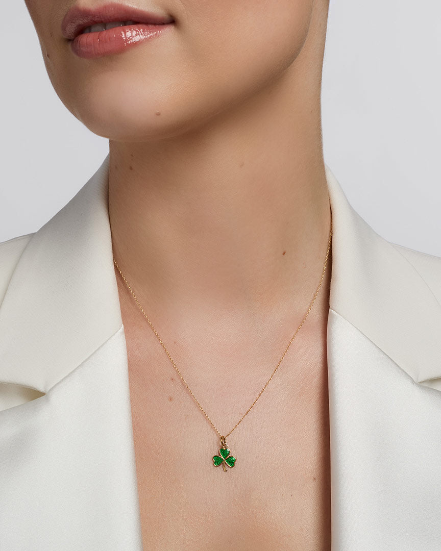  solvar green enamel gold shamrock necklace on a model