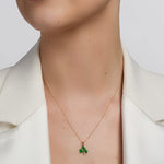  solvar green enamel gold shamrock necklace on a model