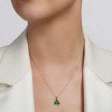  solvar green enamel gold shamrock necklace on a model