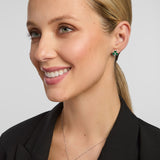 Female model wearing matching shamrock earrings and a necklace set from Solvar