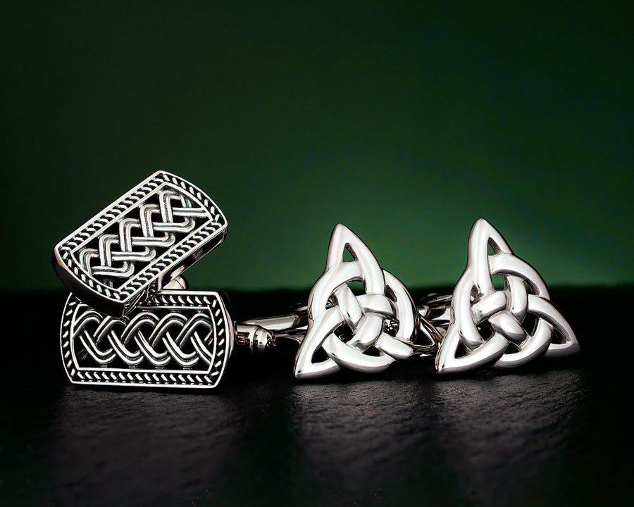 celtic style silver cufflinks on the dark background