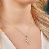 a model wearing hand engraved gold celtic cross necklace